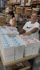 Robert Steve Statello overseeing inventory operations at ST Distribution USA LLC’s Miami warehouse, preparing a large shipment of new iPhones for distribution across Latin America.